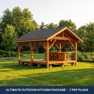 May include: A wooden outdoor pavilion structure with a dark shingled gable roof, featuring an integrated wooden kitchen island with stools underneath, set on a raised platform. The text reads: ULTIMATE OUTDOOR KITCHEN PACKAGE - 7 PDF PLANS