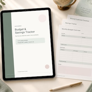 May include: A digital tablet displaying a Budget & Savings Tracker with a sage green and white layout, alongside printed pages featuring a Monthly Budget Overview, Savings Tracker, and Moving Expenses Checklist with minimalist text.