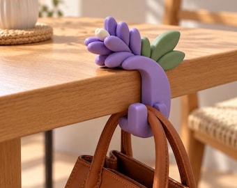 Gancho para bolsos de mesa color lavanda fundida, impreso en 3D en PLA y PETG, colgador de bolsos portátil para cafeterías y oficinas.