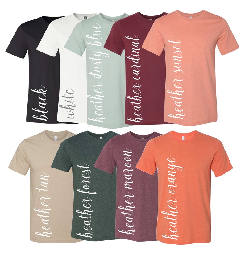 May include: Ten t-shirts in a variety of colours, including black, white, dusty blue, cardinal, sunset, tan, forest, maroon, and orange. Each shirt has a different colour and a white text label on the side that says "heather" followed by the colour name.
