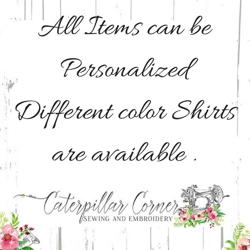 May include: Text on a white wood background with a floral design. The text reads "All Items can be Personalised Different colour Shirts are available. Caterpillar Corner SEWING AND EMBROIDERY"