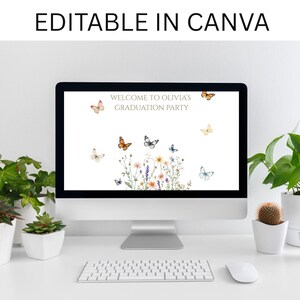 May include: A computer monitor displays a graduation party invitation with butterflies and floral accents. The text "WELCOME TO OLIVIA'S GRADUATION PARTY" is at the top. The words "EDITABLE IN CANVA" are at the top of the image.