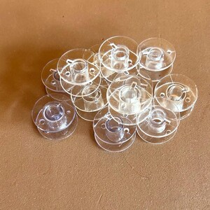Clear Empty Plastic Bobbin Spools - Class 15 - 12 count