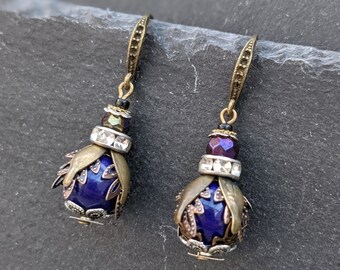 A unique pair of handmade brass, silver & blue steam punk clockwork and bead bee / beetle / insect earrings.