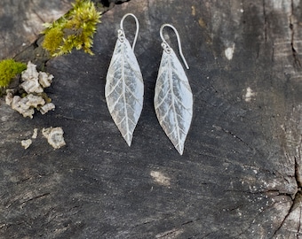 Handcrafted leaf-shaped earrings with organic texture