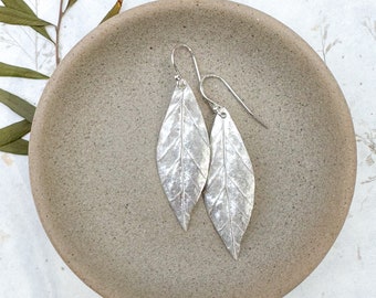 Handcrafted leaf-shaped earrings with organic texture
