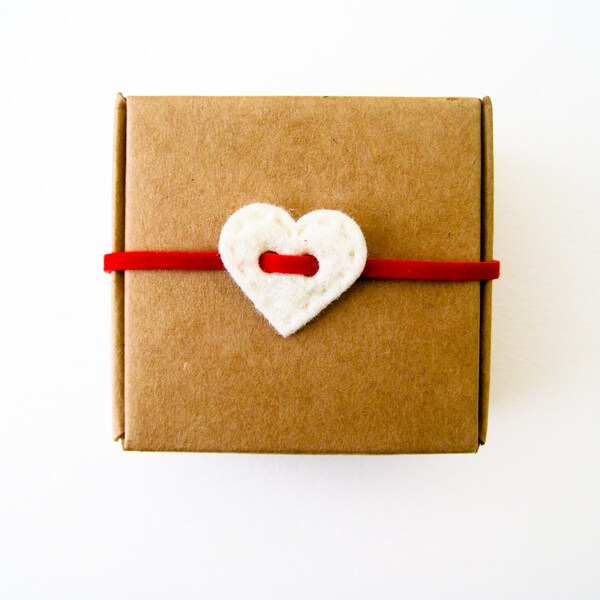 Cardboard box with white heart decoration and British Union jack studs heart shaped