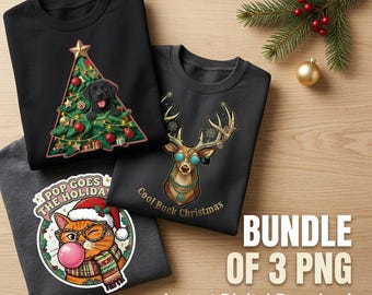 May include: Three black and dark grey sweatshirts featuring festive graphics. One shows a black dog in a Christmas tree, another a deer with glasses and the text Cool Buck Christmas, and the third a cat with glasses, a scarf, and the text Pop Goes The Holidays.