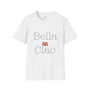 May include: White t-shirt with the words "Bella Ciao" in black script. The word "Ciao" is below "Bella", with a small graphic of diverse figures between the words. The shirt has a crew neck and short sleeves.