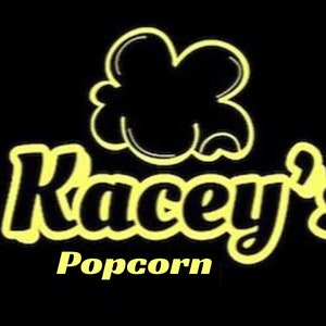 May include: A yellow logo on a black background with the text "Kacey's Popcorn". The logo features a stylized popcorn kernel.