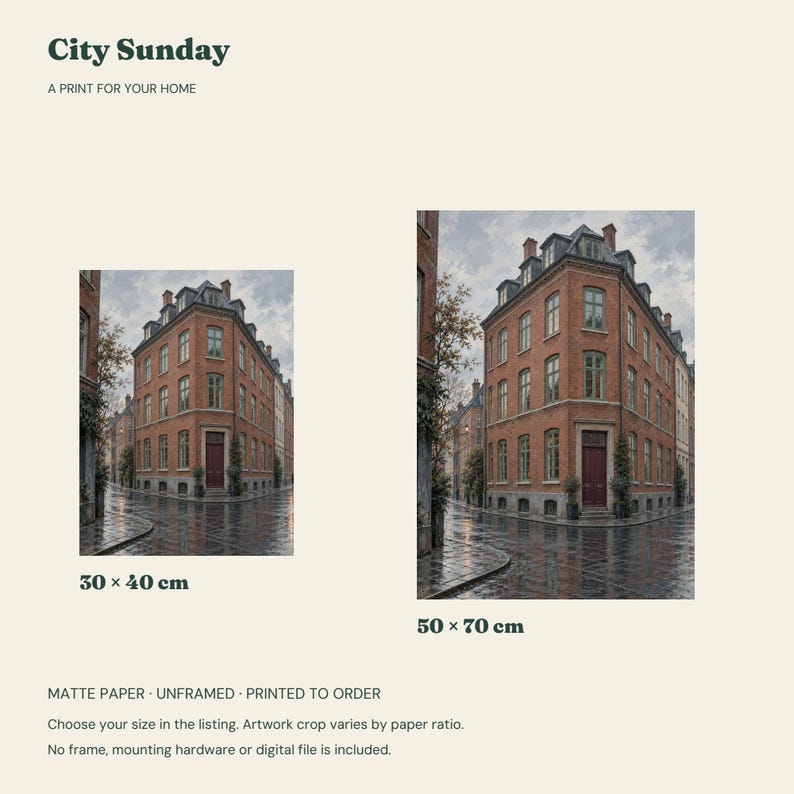 May include: City Sunday print for your home featuring a red brick corner building on a wet street. Two size options are displayed: 30 x 40 cm and 50 x 70 cm. The artwork is printed on matte paper, is unframed, and is printed to order.
