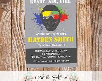 May include: A gray and yellow invitation for a paintball party. The invitation features a black paintball mask with colorful paint splatters. The text reads "Ready, Aim, Fire", "You're invited to join Hayden Smith for a Paintball Party", "Sunday, January 28th at 2:00PM", "The Paintball Field", "2378 Paintball Fun Lane - Houston, TX", "RSVP by January 14th to 337-540-9807", "Notable Affairs", "fun. modern. stylish.", "Invitations & More".