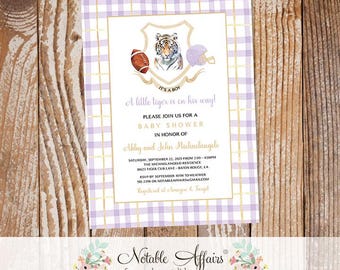 May include: Baby shower invitation with a lilac and white gingham pattern. The invitation features a tiger illustration, football, and helmet. Text reads "It's a boy!" and event details.