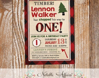 May include: A red and black plaid invitation with a burlap background. The invitation is for a birthday party for a boy named Lennon Walker who is turning one. The invitation says "Timber! Lennon Walker has chopped his way to ONE!" and includes a small green pine tree graphic. The party is on Saturday, January 13, 2018 from 4:00 to 6:00 PM at Lennon's Forest, 237 Highland Drive, Houston, TX. The invitation also includes a small axe graphic.