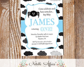May include: A black and white invitation with a blue ribbon and a cartoon spider. The invitation says "Come celebrate and have some fun... Itsy Bitsy JAMES is turning ONE!"  Saturday, November 19th at 2:00pm 247 Spider View Lane Houston, TX RSVP by November 12th to Heather 555-2490 or notableaffairs@gmail.com