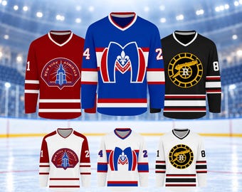 May include: Six hockey jerseys in red, blue, black, and white colorways. The jerseys feature various team logos, including New York Admirals, a stylized M with a fleur-de-lis, and a cannon emblem. Each jersey has a V-neck collar and numbers.
