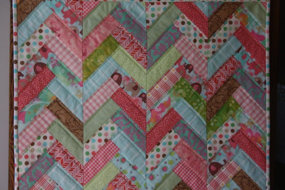 Friendship braid art quilt in oranges, greens, turquoises, textile wall hanging in elephant theme