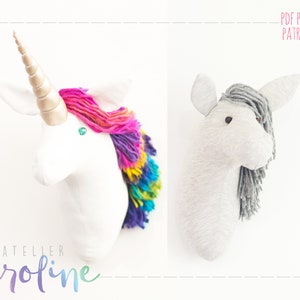 Op de afbeelding: Twee unicorn-hoofd wanddecor patronen. Eén is wit met een regenboogmanen en een gouden hoorn. De andere is grijs met een grijze manen. PDF PATTERN PATRON PDF.