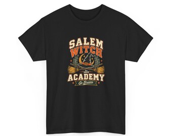 May include: A black short-sleeve t-shirt featuring a graphic with the text Salem Witch Academy Est. 1692 Go Brooms. The design includes a witch hat, two crossed broomsticks, a crescent moon, and stars in orange, yellow, and white colors.