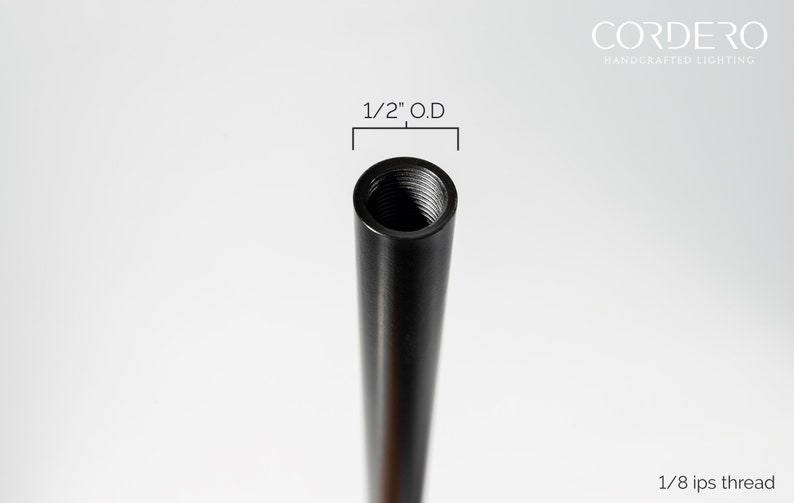 May include: Close-up of a black metal pipe with a 1/2" outer diameter and 1/8 ips thread. The pipe is threaded on one end.