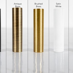 May include: Five metal samples in different finishes: flat black, antique brass, brushed brass, satin white, and bronze.