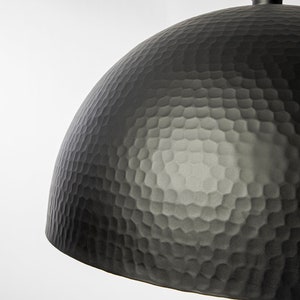 May include: A black hammered metal dome pendant light fixture.