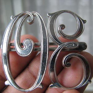 May include: A rustic wooden sign with the text "Welcome to our home" in white lettering. The sign features a distressed finish and a simple, inviting design, perfect for a front porch or entryway.