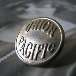 These are original 5/8" old Union Pacific uniform buttons