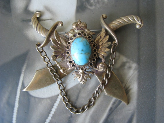 Metal brooch deals