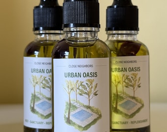 May include: Three clear glass dropper bottles filled with a golden liquid. Each bottle features a white label with the text CLOSE NEIGHBORS, URBAN OASIS, and REST-SANCTUARY-REPLENISHMENT, alongside a watercolor illustration of a small pool.