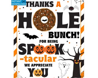 May include: A Halloween-themed printable sign with a donut, pumpkins, bats, and a spooky tree. The sign reads "Thanks a Hole Bunch! For Being Spook-tacular, We Appreciate You." The design features orange, black, and white colors.