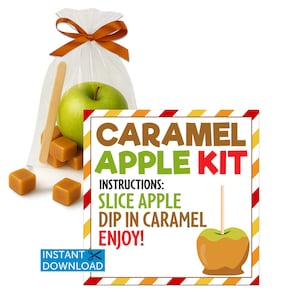 May include: A caramel apple kit with a green apple, caramel cubes, and wooden sticks in a clear bag tied with a brown ribbon. A sign reads "CARAMEL APPLE KIT" with instructions and a caramel apple illustration.