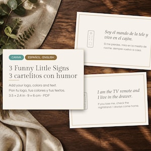 May include: Three rectangular signs with cream backgrounds and thin brown borders. One sign reads 3 Funny Little Signs, 3 cartelitos con humor, 3.5 x 2.4 in, 9 x 6 cm. Another reads Soy el mando de la tele y vivo en el cajón. The third reads I am the TV remote and I live in the drawer.