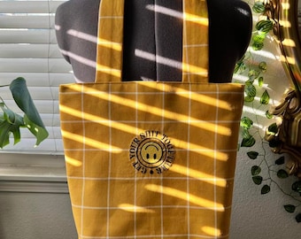 Reúne tu bolsa de tote bordada de mierda