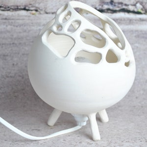 Ambient lamp, to be placed, in raw ceramic
