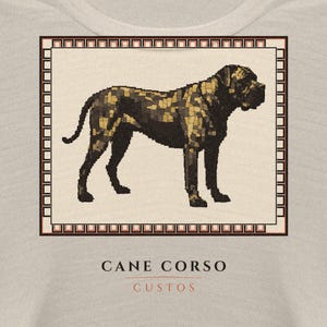 May include: A light beige t-shirt featuring a rectangular graphic of a Cane Corso dog rendered in a mosaic style with black and gold tones. The dog is framed by a geometric border. Below the graphic, the text reads CANE CORSO and CUSTOS.