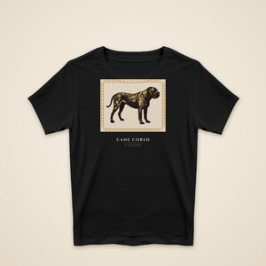 May include: A black short-sleeve t-shirt featuring a centered rectangular graphic of a Cane Corso dog in shades of brown and black. Below the dog, the text reads CANE CORSO and CUSTOS in white capital letters with a horizontal line between them.