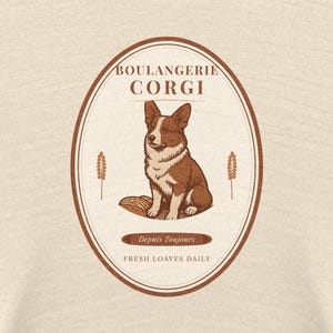 May include: A beige fabric featuring a brown oval graphic with a Corgi dog illustration. The text reads BOULANGERIE CORGI, Depuis Toujours, and FRESH LOAVES DAILY. Two wheat stalks flank the dog, which sits beside a loaf of bread.