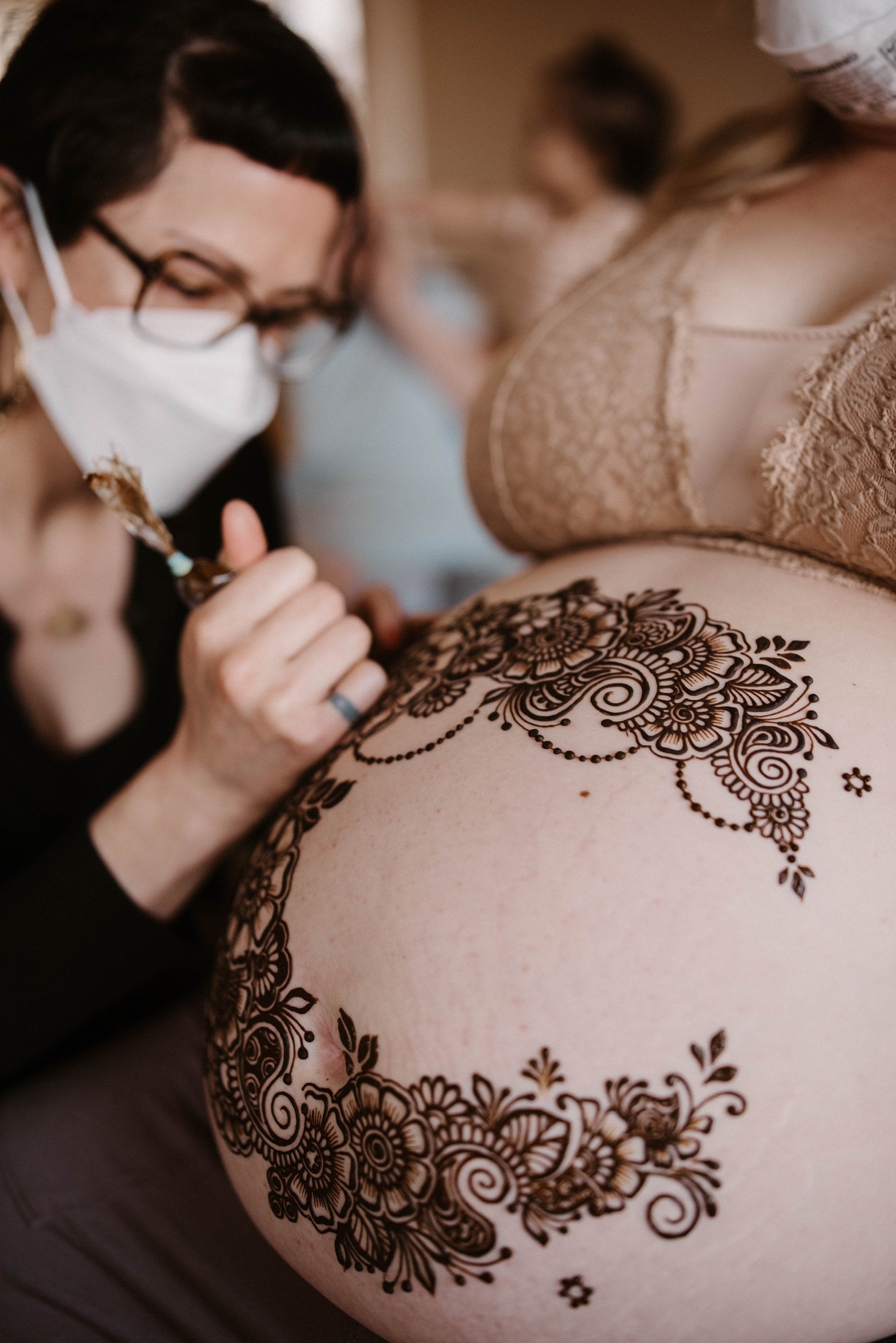 Harmless Henna Floral Drawing Art on Boho Pregnant Woman Tummy