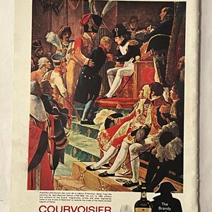 May include: An advertisement for Courvoisier Cognac featuring a historical painting of Napoleon. The image shows a scene of Napoleon bestowing honors, with a bottle of Courvoisier and a glass of cognac in the foreground. Text includes "The Brandy of Napoleon."