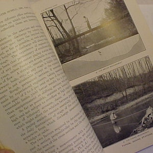 May include: A black and white image of a book with text about surface water supply. The book has two images of a stream with a person standing in the water. The text in the book discusses the importance of selecting the right location for a stream gauge.