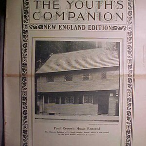 May include: A black and white photograph of Paul Revere's House in Boston, Massachusetts. The caption reads "Paul Revere's House Restored. The Historic Building at 19 North Square, Boston, which is now owned by the Paul Revere Memorial Association."