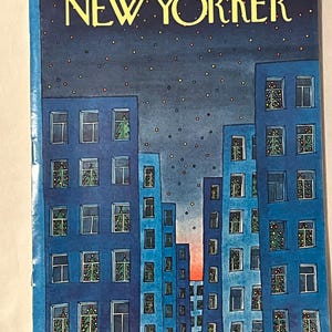 May include: The New Yorker magazine cover from Dec. 17, 1973, featuring blue buildings with Christmas trees in windows under a starry night sky. The magazine title is in yellow, with the price of 50 cents.