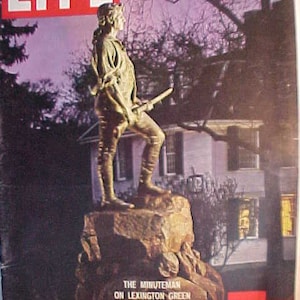 May include: A vintage LIFE magazine cover featuring a bronze statue of a Minuteman on Lexington Green. The cover text reads "A Crucial U.S. Debate On Our National Purpose" and "May 23, 1960".