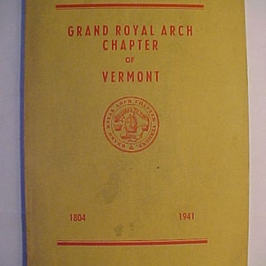 May include: A yellow pamphlet with the text "Grand Royal Arch Chapter of Vermont" and the years "1804" and "1941". A red seal with the text "Grand Arch Chapter" is in the center of the pamphlet.