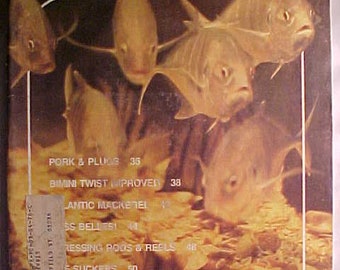 March - April 1976 Fishing World Magazine with cover art by Nancy Kovaric with 90 pages of ads and articles, Hunting Camp Decor