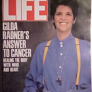 May include: A magazine cover featuring Gilda Radner, a comedian and actress, with the title "LIFE" and the headline "Gilda Radner's Answer to Cancer: Healing the Body with Mind and Heart".
