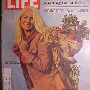 May include: A vintage LIFE magazine cover featuring a woman with long blonde hair carrying a bag of groceries. The cover headline reads "KHRUSHCHEV REMEMBERS" with sub-headlines "The Death of Stalin" and "Getting Rid of Beria". The bottom of the cover reads "ORGANIC FOOD: NEW AND NATURAL" and "DECEMBER 11, 1970 50c".