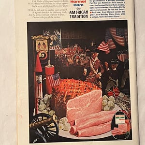 May include: An advertisement for Hormel Ham, featuring a cooked ham with slices, surrounded by patriotic imagery. The ad includes text about the ham's flavor and tradition, with a small inset image of the product.