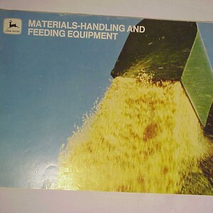 May include: A John Deere brochure titled "Materials-Handling and Feeding Equipment" featuring a green metal hopper pouring yellow grain.